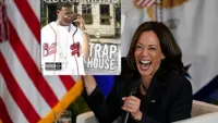 Kamala Harris holding sign