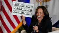 Kamala Harris holding sign