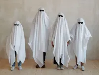 Kids dressed as ghosts Halloween