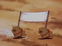 Two dogs carrying a banner